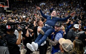 DENVER, CO - JUNE 12: Denver Nuggets head coach Michael Malone is hoisted by star player Nikola Jokic's over brothers, Strahinja and Nemanja, after the fourth quarter of the Nuggets' 94-89 NBA Finals clinching win at Ball Arena in Denver on Monday, June 12, 2023. (Photo by AAron Ontiveroz/The Denver Post)
