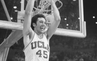 Swen Nater, UCLA, has teammate Henry Bibby on his shoulders after Bibby cut down the net after winning the NCAA.  (Photo by Bettmann Archive/Getty Images)