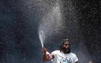 DENVER, COLORADO - JUNE 15: DeAndre Jordan #6 sprays champagne during the Denver Nuggets victory parade and rally after winning the 2023 NBA Championship at Civic Center Park on June 15, 2023 in Denver, Colorado. NOTE TO USER: User expressly acknowledges and agrees that, by downloading and or using this photograph, User is consenting to the terms and conditions of the Getty Images License Agreement. (Photo by Matthew Stockman/Getty Images)