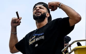 DENVER, CO - JUNE 15: Jamal Murray (27) of the Denver Nuggets flexes for the fans during the team's championship parade in downtown Denver on Thursday, June 15, 2023. (Photo by AAron Ontiveroz/The Denver Post)