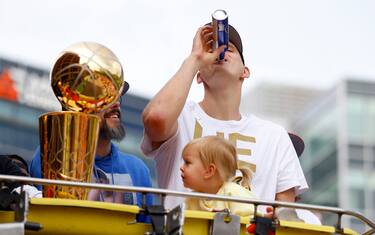 DENVER, COLORADO - JUNE 15: Nikola Jokic #15 drinks a beer near the Larry O'Brien Championship Trophy during the Denver Nuggets victory parade and rally after winning the 2023 NBA Championship on June 15, 2023 in Denver, Colorado. NOTE TO USER: User expressly acknowledges and agrees that, by downloading and or using this photograph, User is consenting to the terms and conditions of the Getty Images License Agreement. (Photo by Justin Edmonds/Getty Images)
