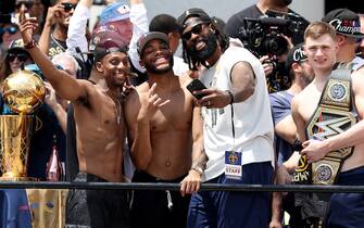 DENVER, COLORADO - JUNE 15: Ish Smith #14, Bruce Brown #11, DeAndre Jordan #6 and Christian Braun #0 celebrate during the Denver Nuggets victory parade and rally after winning the 2023 NBA Championship at Civic Center Park on June 15, 2023 in Denver, Colorado. NOTE TO USER: User expressly acknowledges and agrees that, by downloading and or using this photograph, User is consenting to the terms and conditions of the Getty Images License Agreement. (Photo by Matthew Stockman/Getty Images)