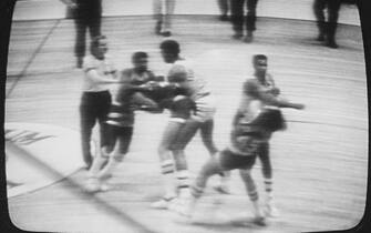 (Original Caption) December 12, 1977, New York: Los Angeles Lakers forward Kermit Washington was fined an NBA league-maximum $10,000 and suspended for at least 60 days by NBA Commissioner Lawrence O'Brien for punching Houston's Rudy Tomjanovich in this game at the Inglewood, California, Forum 12/9. Picture from NBC television tape shows Tomjanovich going down at right.