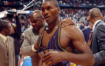 AUBURN HILLS, MI - NOVEMBER 19:  Ron Artest of the Indiana Pacers #91 leaves the floor after a melee involving fans during a game against the Detroit Pistons November 19, 2004 at the Palace of Auburn Hills, in Auburn Hills, Michigan.  NOTE TO USER: User expressly acknowledges and agrees that, by downloading and/or using this Photograph, User is consenting to the terms and conditions of the Getty Images License Agreement. Copyright 2004 NBAE  (Photo by Allen Einstein/NBAE via Getty Images)