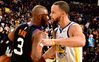 PHOENIX, AZ - DECEMBER 25: Chris Paul #3 of the Phoenix Suns hugs Stephen Curry #30 of the Golden State Warriors after the game on DECEMBER 25, 2021 at Footprint Center in Phoenix, Arizona. NOTE TO USER: User expressly acknowledges and agrees that, by downloading and or using this photograph, user is consenting to the terms and conditions of the Getty Images License Agreement. Mandatory Copyright Notice: Copyright 2021 NBAE (Photo by Barry Gossage/NBAE via Getty Images)