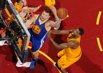 CLEVELAND, OH - JUNE 11: David Lee #10 of the Golden State Warriors goes for the layup against Timofey Mozgov #20 and Tristan Thompson #13 of the Cleveland Cavaliers during Game Four of the 2015 NBA Finals at The Quicken Loans Arena on June 11, 2015 in Cleveland, Ohio. NOTE TO USER: User expressly acknowledges and agrees that, by downloading and/or using this Photograph, user is consenting to the terms and conditions of the Getty Images License Agreement. Mandatory Copyright Notice: Copyright 2015 NBAE (Photo by Andrew D. Bernstein/NBAE via Getty Images)