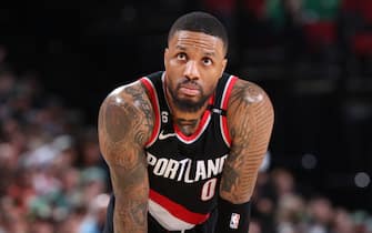 PORTLAND, OR - MARCH 17: Damian Lillard #0 of the Portland Trail Blazers looks on during the game against the Boston Celtics  on March 17, 2023 at the Moda Center Arena in Portland, Oregon. NOTE TO USER: User expressly acknowledges and agrees that, by downloading and or using this photograph, user is consenting to the terms and conditions of the Getty Images License Agreement. Mandatory Copyright Notice: Copyright 2023 NBAE (Photo by Sam Forencich/NBAE via Getty Images)