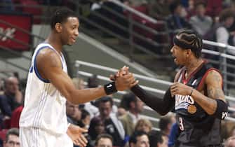 23 Feb 2002:  Tracy McGrady #1of the Orlando Magic and Allen Iverson #3 of the Philadelphia 76ers shake hands before the game at TD Waterhouse Centre in Orlando, Florida. The Magic won 105-87.  DIGITAL IMAGE. NOTE TO USER: User expressly acknowledges and agrees that, by downloading and/or using this Photograph, User is consenting to the terms and conditions of the Getty Images Licence Agreement.  Mandatory copyright notice: Copyright 2002 NBAE\ Mandatory Credit: Fernando Medina/NBAE/Getty Images