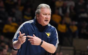 MORGANTOWN, WEST VIRGINIA - JANUARY 18:  Head coach Bob Huggins of the West Virginia Mountaineers signals to his players during a college basketball game against the Baylor Bears at the WVU Coliseum on January 18, 2022 in Morgantown, West Virginia.  (Photo by Mitchell Layton/Getty Images)