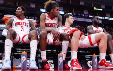 HOUSTON, TEXAS - DECEMBER 17: Kevin Porter Jr. #3, Jalen Green, and Alperen Sengun #28 of the Houston Rockets sit on the bench against the Portland Trail Blazers during the second half at Toyota Center on December 17, 2022 in Houston, Texas. NOTE TO USER: User expressly acknowledges and agrees that, by downloading and or using this photograph, User is consenting to the terms and conditions of the Getty Images License Agreement. (Photo by Carmen Mandato/Getty Images)
