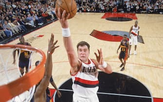 PORTLAND, OR - APRIL 1:  Arvydas Sabonis #11 of the Portland Trail Blazers takes the ball up during the game against the Golden State Warriors at The Rose Garden on April 1, 2003 in Portland, Oregon. The Blazers defeated the Warriors 100-86.  NOTE TO USER: User expressly acknowledges and agrees that, by downloading and/or using this Photograph, User is consenting to the terms and conditions of the Getty Images License Agreement. Mandatory copyright notice:  Copyright 2003 NBAE (Photo by:  Sam Forencich/NBAE via Getty Images)