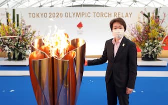 epa09095389 A handout photo made available by Tokyo 2020 shows Tokyo 2020 Organising Committee President Seiko Hashimoto posing in the first leg of the torch relay for Tokyo Olympic Games at the J-Village National Training Center in Naraha, Fukushima prefecture, Japan, 25 March 2021. The postponed Tokyo 2020 Olympic Games are scheduled to start on 23 July 2021 and some 10,000 torchbearers will run across the country along a 121-day journey.  EPA/TOKYO 2020 / HANDOUT  HANDOUT EDITORIAL USE ONLY/NO SALES