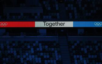 34513690 TOKYO, JAPAN - AUGUST 8, 2021: An LED screen shows 'Together' against a white, red and blue background during the closing ceremony of the 2020 Summer Olympic Games at the Japan National Stadium (a.k.a the Olympic Stadium). The Olympic Games were held amid the COVID-19 pandemic. The closing ceremony features live and pre-recorded elements. Sergei Bobylev/TASS/Sipa USA