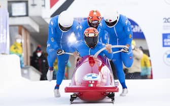 epa09689629 Patrick Baumgartner of Italy and teammates in action during the Men's Four Man Bob World Cup in St. Moritz, Switzerland, 16 January 2022.  EPA/MAYK WENDT