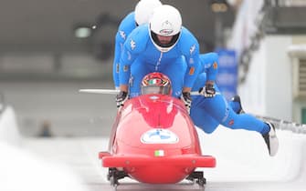 epa09638358 Mattia Variola, Robert Mircea,  Alex Pagnini and Jose Delmas Obou of Italy in action during the first run of the four-man competition at the IBSF Skeleton and Bobsleigh World Cup in Winterberg, Germany, 12 December 2021.  EPA/FRIEDEMANN VOGEL
