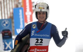 epa08930062 Andrea Voetter of Italy reacts in the finish area during the Women's single race at the Luge World Cup event in Sigulda, Latvia, 10 January 2021.  EPA/TOMS KALNINS