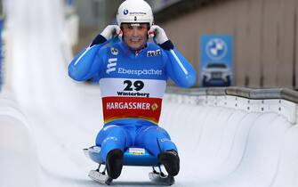 epa09662844 Dominik Fischnaller of Italy reacts during the second run of the Men's Singles Race at the Luge World Cup in Winter?berg, Germany, 01 January 2022.  EPA/RONALD WITTEK