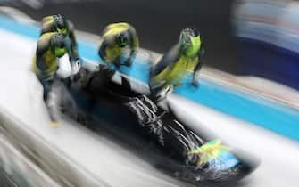 YANQING, CHINA - FEBRUARY 19: Shanwayne Stephens, Ashley Watson, Rolando Reid and Matthew Wekpe of Team Jamaica slide during the four-man Bobsleigh heats on day 15 of Beijing 2022 Winter Olympic Games at National Sliding Centre on February 19, 2022 in Yanqing, China. (Photo by Adam Pretty/Getty Images)