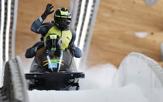 YANQING, CHINA - FEBRUARY 19: Shanwayne Stephens, Ashley Watson, Rolando Reid and Matthew Wekpe of Team Jamaica react to their slide during the four-man Bobsleigh heats on day 15 of Beijing 2022 Winter Olympic Games at National Sliding Centre on February 19, 2022 in Yanqing, China. (Photo by Adam Pretty/Getty Images)
