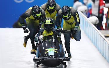 YANQING, CHINA - FEBRUARY 19: Shanwayne Stephens, Ashley Watson, Rolando Reid and Matthew Wekpe of Team Jamaica slide during the four-man Bobsleigh heats on day 15 of Beijing 2022 Winter Olympic Games at National Sliding Centre on February 19, 2022 in Yanqing, China. (Photo by Julian Finney/Getty Images)