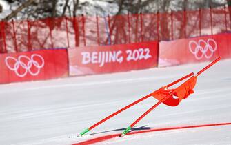 YANQING, CHINA - FEBRUARY 19: A gate is blown over during the weather delays prior to the start of the Mixed Team Parallel event on day 15 of the Beijing 2022 Winter Olympic Games at National Alpine Ski Centre on February 19, 2022 in Yanqing, China. (Photo by Tom Pennington/Getty Images)