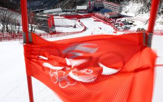 YANQING, CHINA - FEBRUARY 19: A gate is blown over during the weather delays prior to the start of the Mixed Team Parallel event on day 15 of the Beijing 2022 Winter Olympic Games at National Alpine Ski Centre on February 19, 2022 in Yanqing, China. (Photo by Tom Pennington/Getty Images)