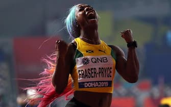 epa07880864 Shelly-Ann Fraser-Pryce of Jamaica celebrates after winning the women's 100m final during the IAAF World Athletics Championships 2019 at the Khalifa Stadium in Doha, Qatar, 29 September 2019. EPA/SRDJAN SUKI