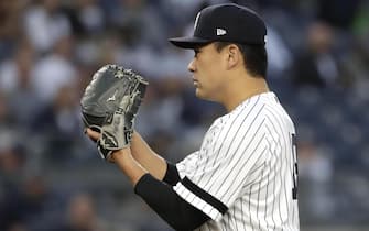 epa07854840 New York Yankees starting pitcher Masahiro Tanaka of Japan prepares to throw to the Los Angeles Angels in the first inning of the MLB game between the Los Angeles Angels and the New York Yankees at Yankee Stadium in the Bronx, New York, USA, 19 September 2019.  EPA/JASON SZENES