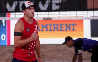 epa08684724 Christian Sandlie Sorum (L) of Norway in action during the men's 1st place match with compatriot Anders Berntsen Mol against Viacheslav Krasilnikov and Oleg Stoyanovskiy of Russia at the 2020 CEV Beach Volleyball European Championships in Jurmala, Latvia, 20 September 2020.  EPA/TOMS KALNINS