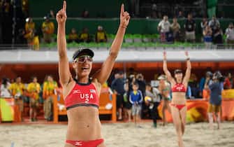 USA's April Ross (L) and Kerri Walsh Jennings celebrate after defeating Australia in the women's beach volleyball quarter-final match at the Beach Volley Arena in Rio de Janeiro on August 15, 2016, for the Rio 2016 Olympic Games. / AFP / LEON NEAL        (Photo credit should read LEON NEAL/AFP via Getty Images)