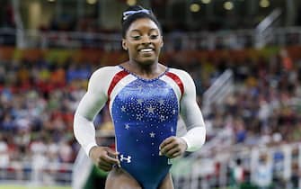 epa05474975 Simone Biles of the USA smiles after her performance on the Beam in the women's Individual All-Around final of the Rio 2016 Olympic Games Artistic Gymnastics events at the Rio Olympic Arena in Barra da Tijuca, Rio de Janeiro, Brazil, 11 August 2016.  EPA/TATYANA ZENKOVICH
