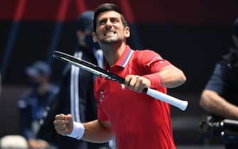 epa08980716 Novak Djokovic of Serbia reacts after winning an ATP Cup tennis match against Denis Shapovalov of Canada at Melbourne Park in Melbourne, Australia, 02 February 2021.  EPA/DAVE HUNT EDITORIAL USE ONLY