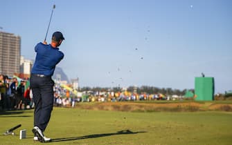 epa05481277 Henrik Stenson of Sweden hits from the seventeenth tee during the third round of the Rio 2016 Olympic Games men's golf tournament at the Olympic Golf Course in Barra da Tijuca, Rio de Janeiro, Brazil, 13 August 2016.  EPA/ERIK S. LESSER