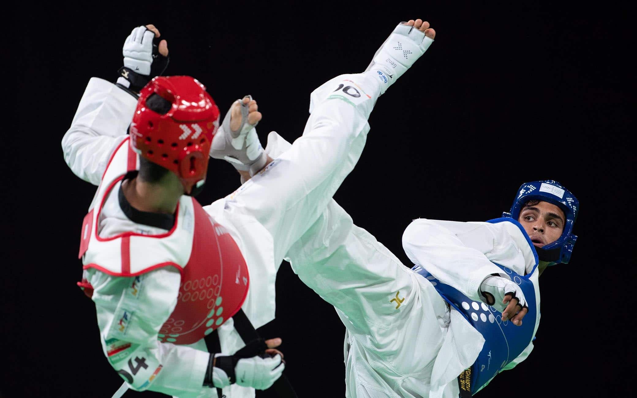 epa07087095 Nisar Ahmad Abdul Rahimzai of Afghanistan (R) and Mohammadali Khosravi of Iran (L) compete in the Taekwondo Mens 73kg Semi-final in the Oceania Pavilion, Youth Olympic Parkduring the Youth Olympic Games, Buenos Aires, Argentina, 11 October 2018.  EPA/Lukas Schulze  for OIS/IOC HANDOUT  HANDOUT EDITORIAL USE ONLY/NO SALES