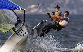epaselect epa05497563 Peter Burling and Blair Tuke of New Zealand react after winning the gold medal in the men's 49er class medal race of the Rio 2016 Olympic Games Sailing events in Rio de Janeiro, Brazil, 18 August 2016.  EPA/NIC BOTHMA