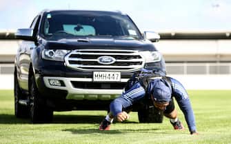 AUCKLAND, NEW ZEALAND - MAY 07: All Black and Blues prop Ofa Tu'ungafasi pulls his SUV in a harness as he uses it in place of a scrum machine while he trains in isolation at the Blues HQ at Alexandra Park due to the coronavirus lockdown on May 07, 2020 in Auckland, New Zealand. New Zealand has been in lockdown since Thursday 26 March following tough restrictions imposed by the government to stop the spread of COVID-19 across the country.  (Photo by Phil Walter/Getty Images)