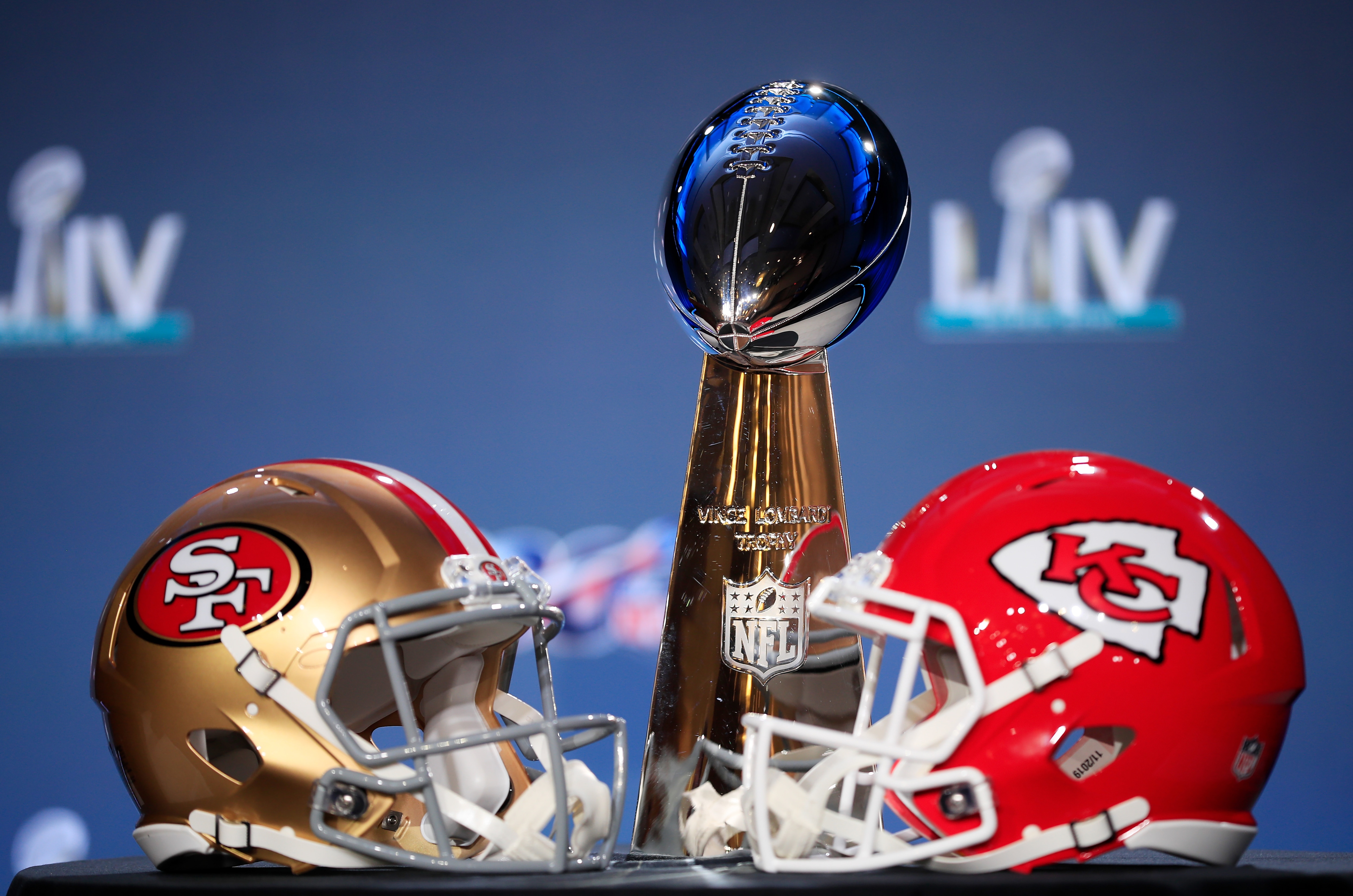 1202768827 MIAMI, FLORIDA - JANUARY 29: The Vince Lombardi Trophy is displayed with helmets of the San Francisco 49ers and Kansas City Chiefs prior to a press conference with NFL Commissioner Roger Goodell for Super Bowl LIV at the Hilton Miami Downtown on January 29, 2020 in Miami, Florida. The 49ers will face the Chiefs in the 54th playing of the Super Bowl, Sunday February 2nd. (Photo by Cliff Hawkins/Getty Images)