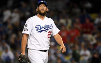 LOS ANGELES, CALIFORNIA - OCTOBER 09:  Clayton Kershaw #22 of the Los Angeles Dodgers reacts as he leaves the game after giving up back to back home runs in the eighth inning of game five of the National League Division Series against the Washington Nationals at Dodger Stadium on October 09, 2019 in Los Angeles, California. (Photo by Harry How/Getty Images)