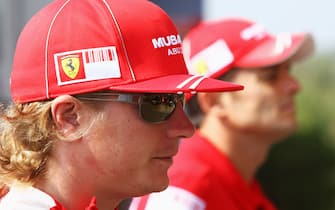 90541439 MONZA, ITALY - SEPTEMBER 10: Kimi Raikkonen (L) of Finland and Ferrari and Giancarlo Fisichella (R) of Italy and Ferrari are seen during previews to the Italian Formula One Grand Prix on September 10, 2008 in Monza, Italy. (Photo by Clive Rose/Getty Images)