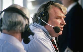 UNSPECIFIED - CIRCA 1986:  CBS NFL commentator Pat Summerall (L) and NFL analyst John Madden (R) on the air prior during an NFL Football game circa 1986.  (Photo by Focus on Sport/Getty Images)