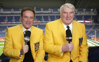DENVER, CO - NOVEMBER 11:  The longest running primetime sports program in television history, ABC's NFL "Monday Night Football," celebrates its 500th game on 11/11/02 at Invesco Field At Mile High in Denver, Colorado, in a game between the Oakland Raiders and Denver Broncos.  Wearing the yellow blazers which were identified with ABC Sports during the 1960's through the 1980's ,  are the current team of broadcasters, Al Michaels (left) and John Madden.  (Photo by Craig Sjodin/ABC/Walt Disney Television via Getty images) AL MICHAELS, JOHN MADDEN
