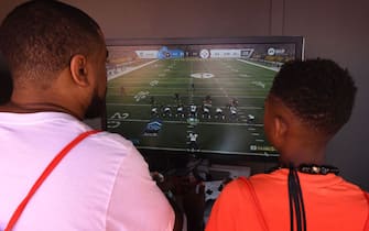 Gamers play a new version of the 'EA SPORTS Madden NFL' video game at the EA PLAY event in Hollywood, California on June 8, 2019. (Photo by Mark RALSTON / AFP)        (Photo credit should read MARK RALSTON/AFP via Getty Images)