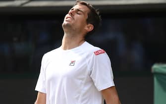 Argentina's Guido Pella reacts to missing a point against Spain's Roberto Bautista Agut during their men's singles quarter-final match on day nine of the 2019 Wimbledon Championships at The All England Lawn Tennis Club in Wimbledon, southwest London, on July 10, 2019. (Photo by Ben STANSALL / AFP) / RESTRICTED TO EDITORIAL USE        (Photo credit should read BEN STANSALL/AFP/Getty Images)