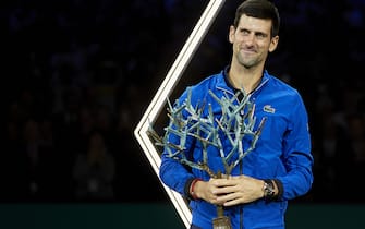PARIS, FRANCE - NOVEMBER 03:  Novak Djokovic of Serbia celebrates with the trophy after victory in the Mens Singles Final match against Denis Shapovalov of Canada during day seven of the Rolex Paris Masters at AccorHotels Arena on November 03, 2019 in Paris, France. (Photo by Quality Sport Images/Getty Images)