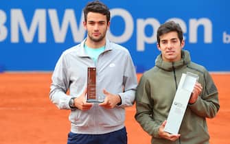 MUNICH, GERMANY - MAY 05: Cristian Garin (L) of Chile poses his winners trophy for the BMW Open 2019 after winning his final match against Matteo Berrettini of Italy on day 9 of the BMW Open at MTTC IPHITOS on May 05, 2019 in Munich, Germany. (Photo by Alexander Hassenstein/Getty Images for BMW)