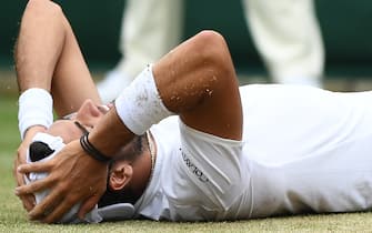 Italy's Matteo Berrettini celebrates after beating Argentina's Diego Schwartzman during their men's singles third round match on the sixth day of the 2019 Wimbledon Championships at The All England Lawn Tennis Club in Wimbledon, southwest London, on July 6, 2019. (Photo by Ben STANSALL / AFP) / RESTRICTED TO EDITORIAL USE        (Photo credit should read BEN STANSALL/AFP via Getty Images)