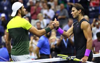 NEW YORK, NEW YORK - SEPTEMBER 06: Rafael Nadal of Spain shakes hands at the net after his straight sets victory in his Men's Singles semi-final match against Matteo Berrettini of Italy on day twelve of the 2019 US Open at the USTA Billie Jean King National Tennis Center on September 06, 2019 in Queens borough of New York City.   (Photo by Clive Brunskill/Getty Images)