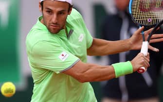 Italy's Stefano Travaglia eyes the ball as he plays a forehand return to France's Adrian Mannarino during their men's singles first round match on day three of The Roland Garros 2019 French Open tennis tournament in Paris on May 28, 2019. (Photo by Anne-Christine POUJOULAT / AFP)        (Photo credit should read ANNE-CHRISTINE POUJOULAT/AFP via Getty Images)