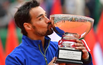 TOPSHOT - Winner Italy's Fabio Fognini kisses the trophy after winning the final tennis match against Serbia's Dusan Lajovic at the Monte-Carlo ATP Masters Series tournament in Monaco on April 21, 2019. (Photo by YANN COATSALIOU / AFP)        (Photo credit should read YANN COATSALIOU/AFP via Getty Images)
