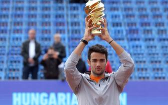 Italy's Matteo Berrettini poses with the trophy after his victory over Serbia's Filip Krajinovic during the ATP final tennis match at the Hungarian Open in Budapest, on April 28, 2019. (Photo by Peter Kohalmi / AFP)        (Photo credit should read PETER KOHALMI/AFP via Getty Images)